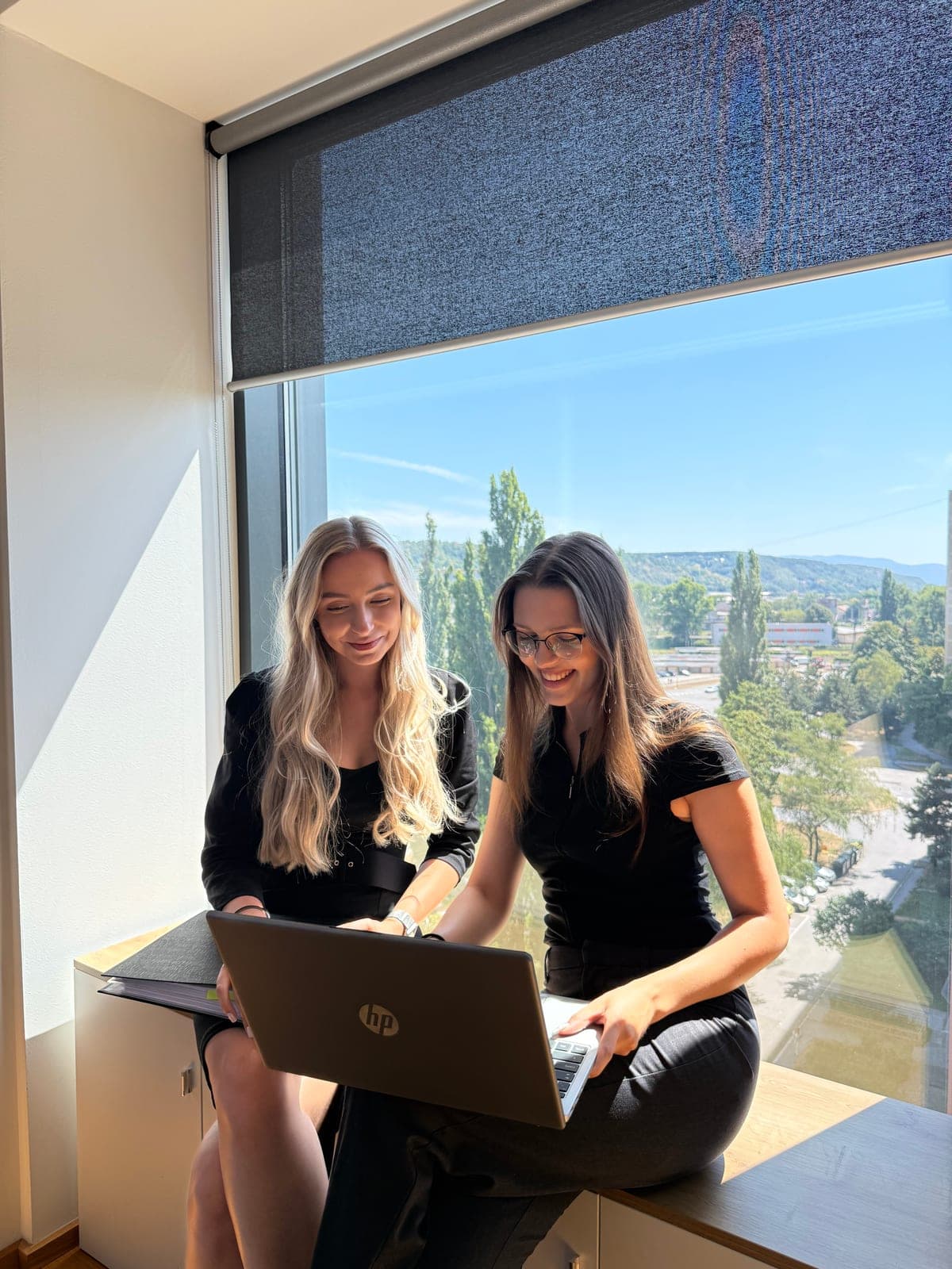 Two Bilvao colleagues working together on a laptop