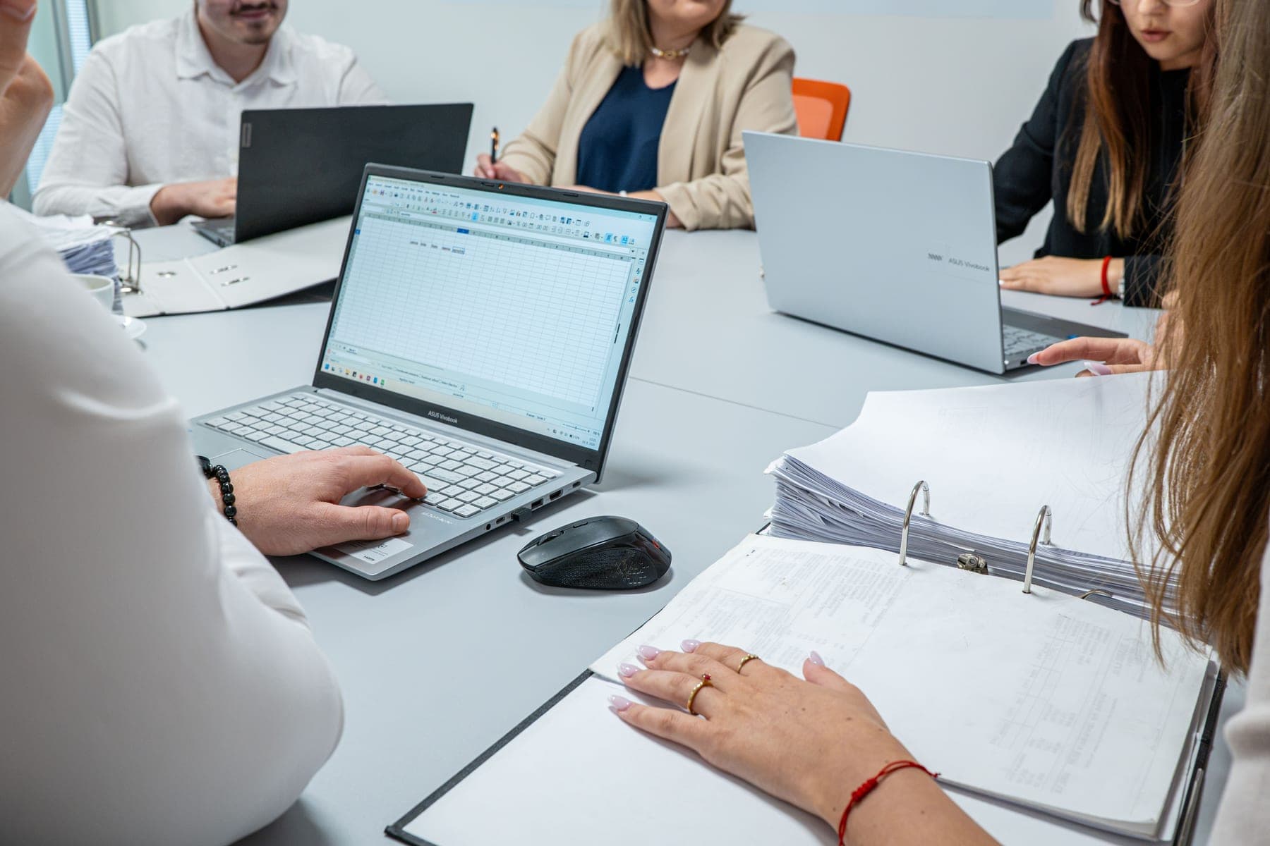 Reviewing paperwork in a meeting